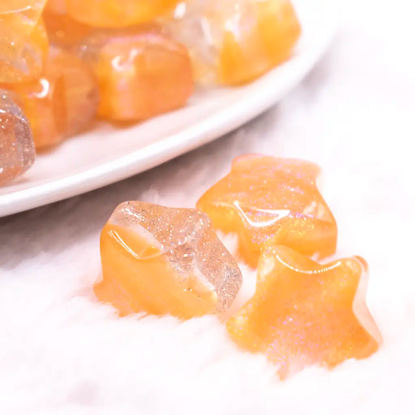 macro view of a pile of 20mm Orange Opal Star Shaped Acrylic Beads