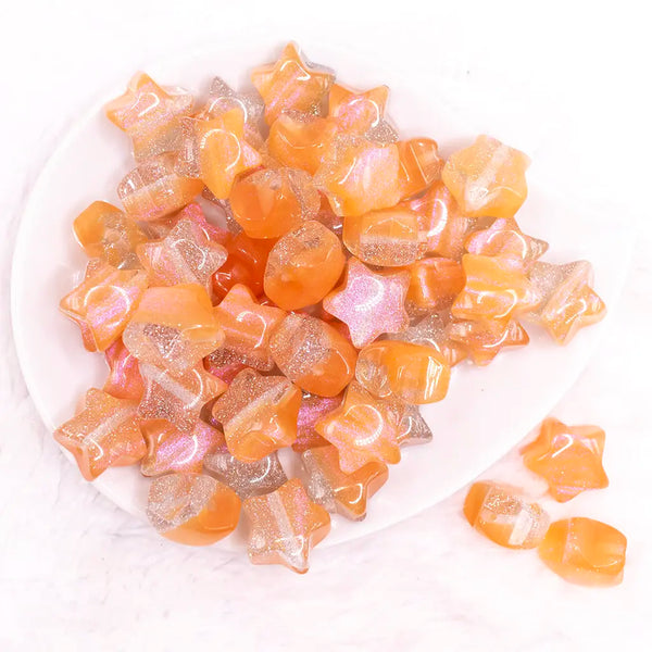 top view of a pile of 20mm Orange Opal Star Shaped Acrylic Beads