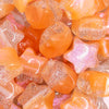 close up view of a pile of 20mm Orange Opal Star Shaped Acrylic Beads