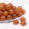 front view of a pile of 20mm Orange Glitter Tinsel Bubblegum Beads