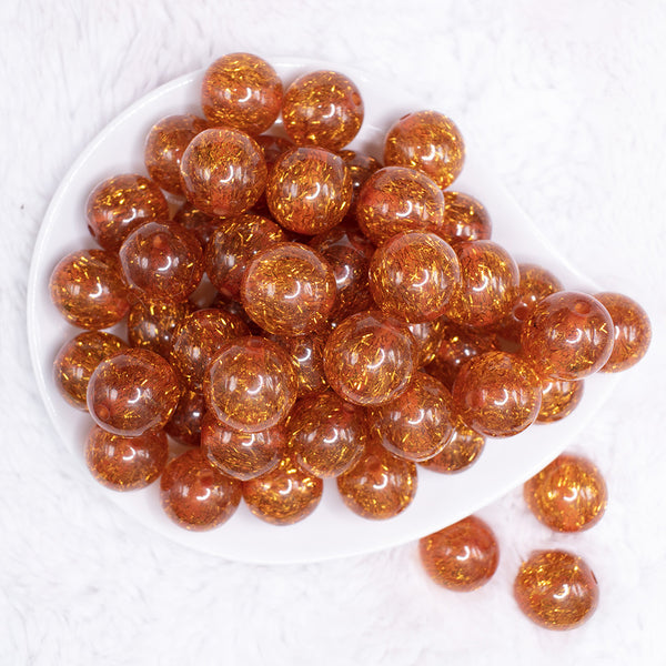 top view of a pile of 20mm Orange Glitter Tinsel Bubblegum Beads