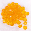 top view of a pile of 20mm Orange Transparent Faceted Bubblegum Beads