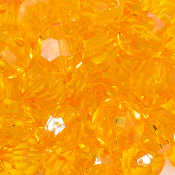 close up view of a pile of 20mm Orange Transparent Faceted Bubblegum Beads