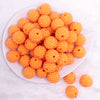 top view of a pile of 20mm Orange with Clear Rhinestone Bubblegum Beads