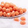 front view of a pile of 20mm Peach Faceted Opaque Bubblegum Beads