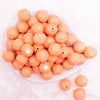 top view of a pile of 20mm Peach Faceted Opaque Bubblegum Beads