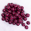 top view of a pile of 20mm Pink and Black Plaid Bubblegum Beads