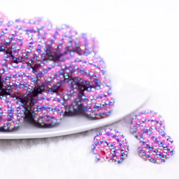 front view of a pile of 20mm Pink and Purple Striped Rhinestone AB Bubblegum Beads