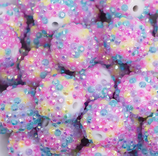 close up view of a pile of 20mm Pink Confetti Rhinestone AB Bubblegum Beads