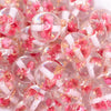 close up view of a pile of 20mm Pink Flaked Flower Bubblegum Bead