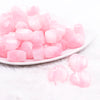 front view of a pile of 20mm Pink Opal Heart Shaped Acrylic Beads