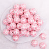 top view of a pile of 20mm Pink Snowflake Print on White Acrylic Bubblegum Beads