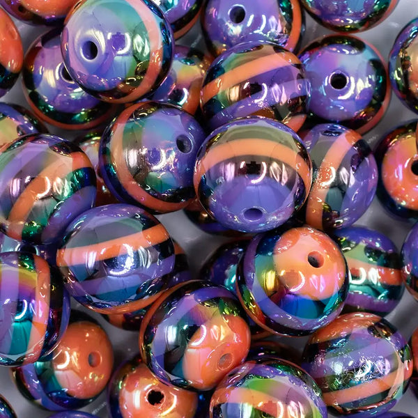 close up view of a pile of 20mm Orange and Purple Stripes AB Bubblegum Beads