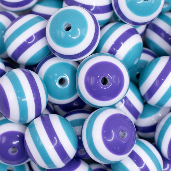 close up view of a pile of 20mm Teal and Purple Stripes Bubblegum Jewelry Beads