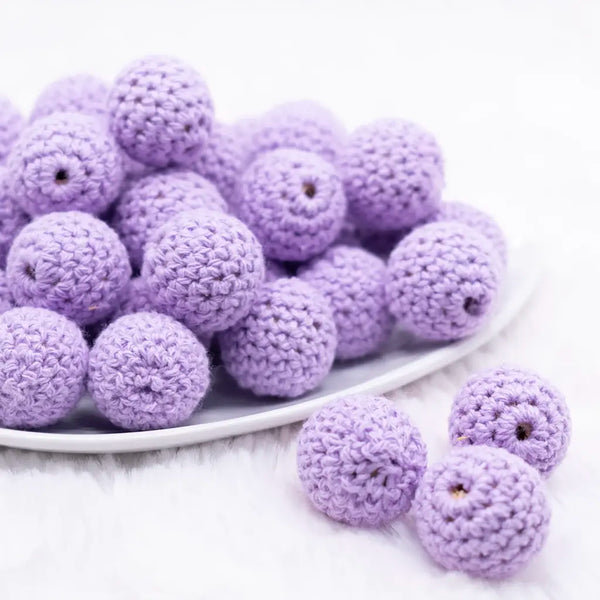 front view of a pile of 20mm Purple Crochet wooden bead