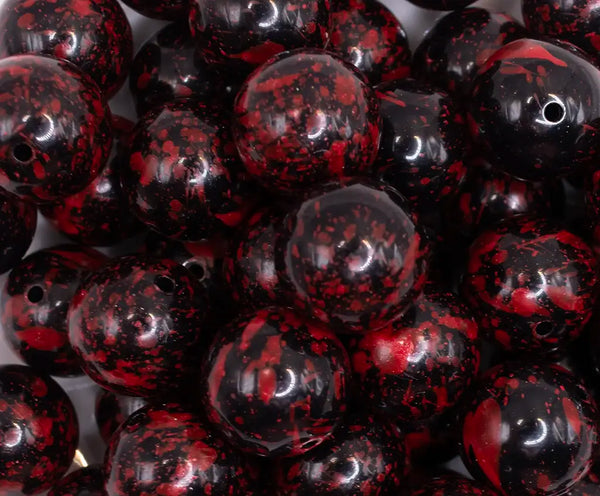 close up view of a pile of 20mm Red and Black Splatter Bubblegum Beads
