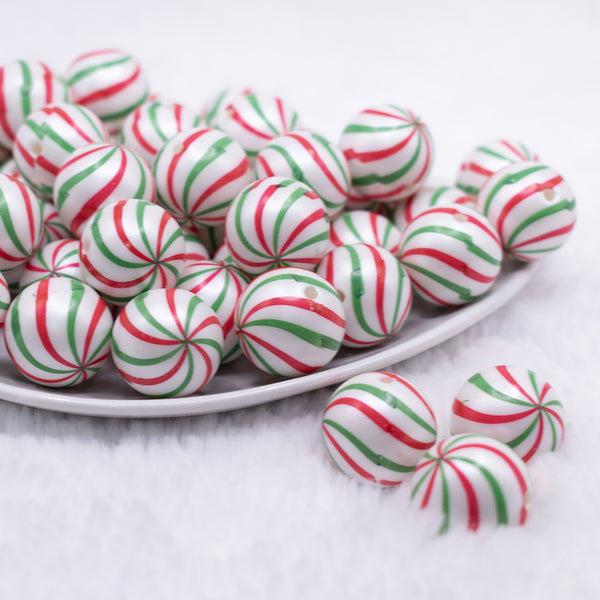 front view of a pile of 20mm Red and Green Peppermint Candy Print Bubblegum Beads