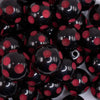 close up view of a pile of 20mm Red Polka Dots on Black Acrylic Bubblegum Beads
