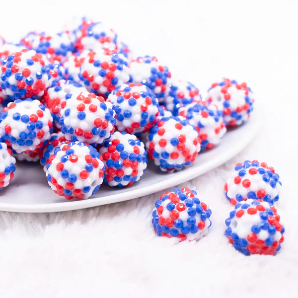 front view of a pile of 20mm Red, White and Blue Confetti Rhinestone Bubblegum Beads