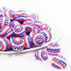 front view of a pile of 20mm Red, White and Blue Striped Rhinestone Bubblegum Beads
