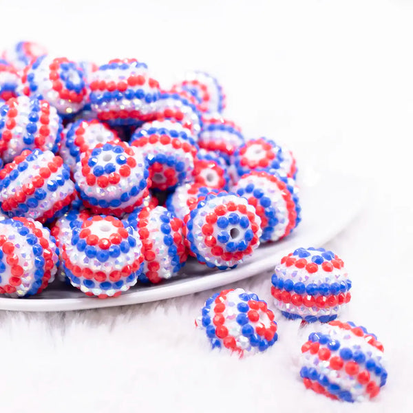 front view of a pile of 20mm Red, White and Blue Striped Rhinestone Bubblegum Beads