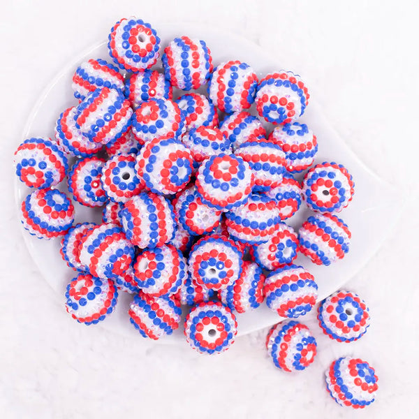 top view of a pile of 20mm Red, White and Blue Striped Rhinestone Bubblegum Beads