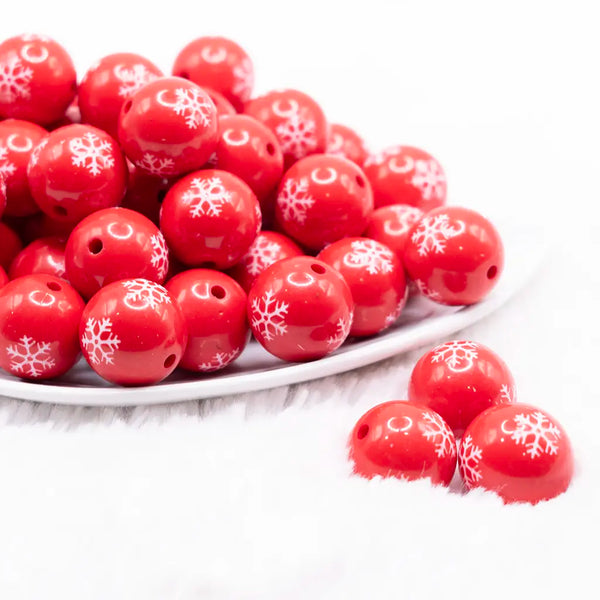 front view of a pile of 20mm Red with White Snowflake Print Bubblegum Beads