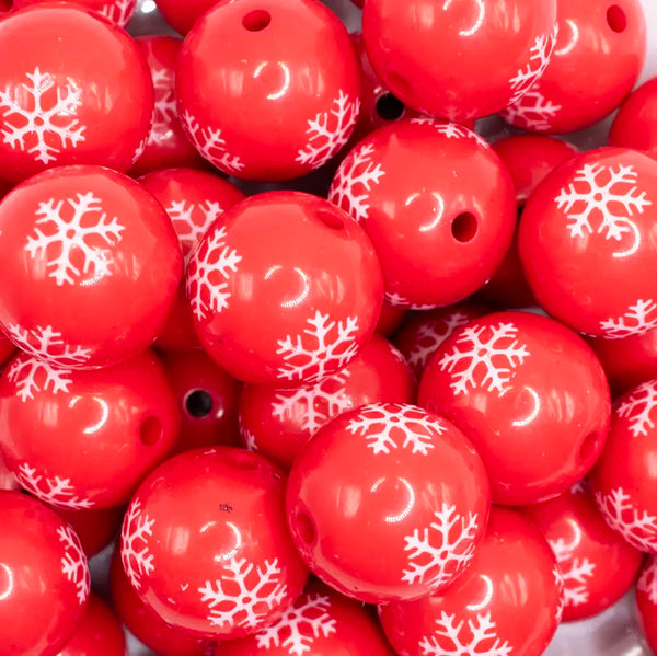 close up view of a pile of 20mm Red with White Snowflake Print Bubblegum Beads