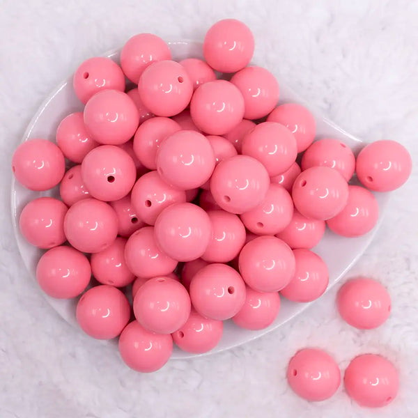 top view of a pile of 20mm Salmon Pink Solid Bubblegum Beads