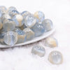 front view of a pile of 20mm Slate Blue Illusion Glitter Bubblegum Bead