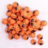 macro view of a pile of 20mm Spider Print on Orange Bubblegum top