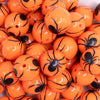 close up view of a pile of 20mm Spider Print on Orange Bubblegum Beads