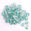 close up view of a pile of 20mm Teal Blue Flaked Flower Bubblegum Bead