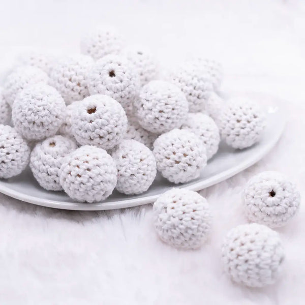 front view of a pile of 20mm White Crochet wooden bead