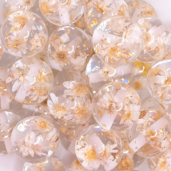 close up view of a pile of 20mm White Flaked Flower Bubblegum Bead