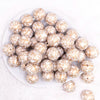 top view of a pile of 20mm White with Gold Filigree Printed Acrylic Bubblegum Beads