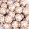 close up view of a pile of 20mm White with Gold Filigree Printed Acrylic Bubblegum Beads