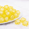 front view of a pile of 20mm Yellow Transparent Cube with Middle Bubblegum Beads