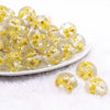 front view of a pile of 20mm Yellow Flaked Flower Bubblegum Bead