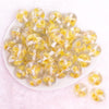 top view of a pile of 20mm Yellow Flaked Flower Bubblegum Bead