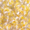close up view of a pile of 20mm Yellow Flaked Flower Bubblegum Bead