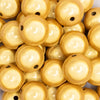close up view of a pile of 20mm Yellow Miracle Bubblegum Bead