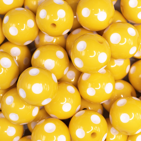 close up view of a pile of 20mm Yellow with White Polka Dots Bubblegum Beads