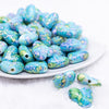 front view of a pile of 23mm Blue Watercolor Heart Acrylic Bead