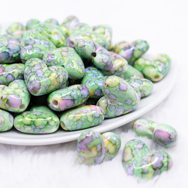 front view of a pile of 23mm Green Watercolor Heart Acrylic Bead