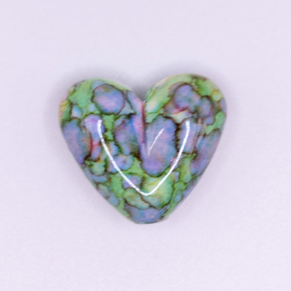 top view of a pile of 23mm Green Watercolor Heart Acrylic Bead