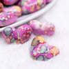 close up view of a pile of 23mm Hot Pink Watercolor Heart Acrylic Bead