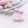close up view of a pile of 23mm Pink Watercolor Heart Acrylic Bead