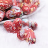 close up view of a pile of 23mm Red Watercolor Heart Acrylic Bead