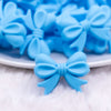 close up view of a pile of 25mm Blue Bow Knot silicone bead